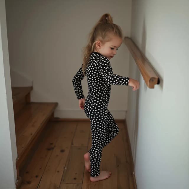 10yo   finnish    skinny child  model  The most beautiful,thin,most pretty and clever   lycra unitard catsuit covered with spots.She always wear civet lycra dancewear stretchy covered with many spots..She goes up the stairs.